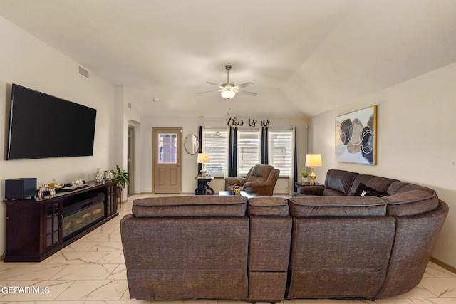 living room featuring ceiling fan and light tile patterned flooring