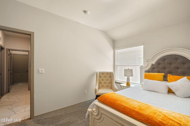 bedroom with vaulted ceiling and light tile patterned floors