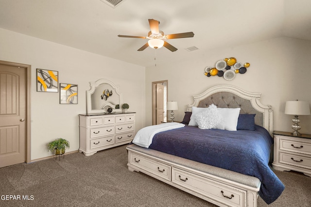 bedroom with ceiling fan, dark carpet, and lofted ceiling