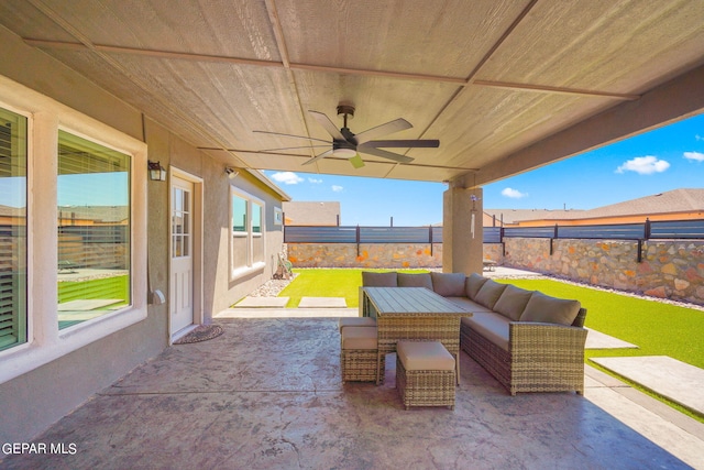 view of patio featuring an outdoor living space and ceiling fan