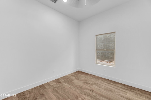 unfurnished room with light wood-type flooring