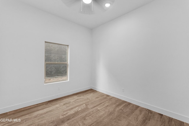 empty room with ceiling fan and wood-type flooring