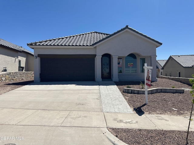 view of front of home with a garage