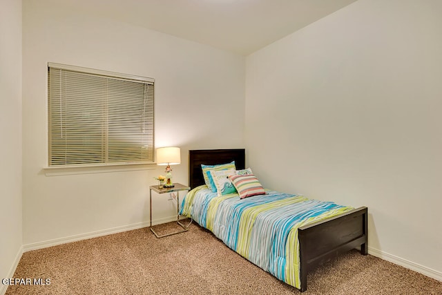 bedroom featuring light carpet