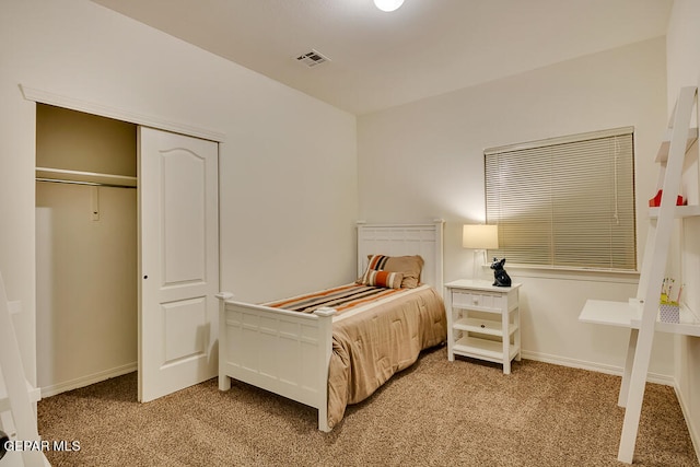 bedroom with light carpet and a closet