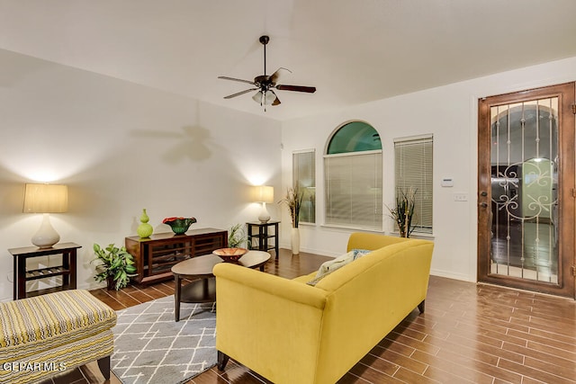 living room with ceiling fan and hardwood / wood-style floors