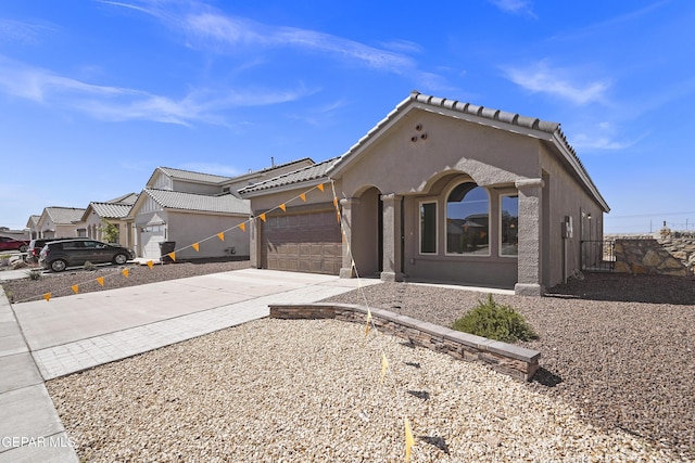 13158 Ludlow Ln, El Paso, TX 79928 - view of front of home with stucco siding, an attached garage, concrete driveway, and a tile roof