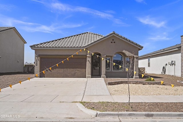13158 Ludlow Ln, El Paso, TX 79928 - view of front of property with an attached garage, driveway, stucco siding, and a tiled roof