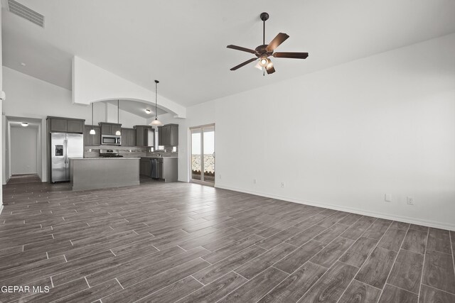 13158 Ludlow Ln, El Paso, TX 79928 - unfurnished living room with a ceiling fan, high vaulted ceiling, and dark wood finished floors