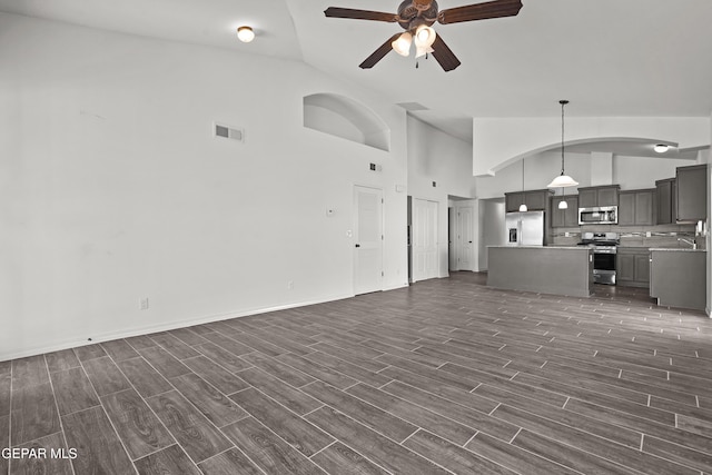 13158 Ludlow Ln, El Paso, TX 79928 - unfurnished living room with ceiling fan, dark wood finished floors, and high vaulted ceiling