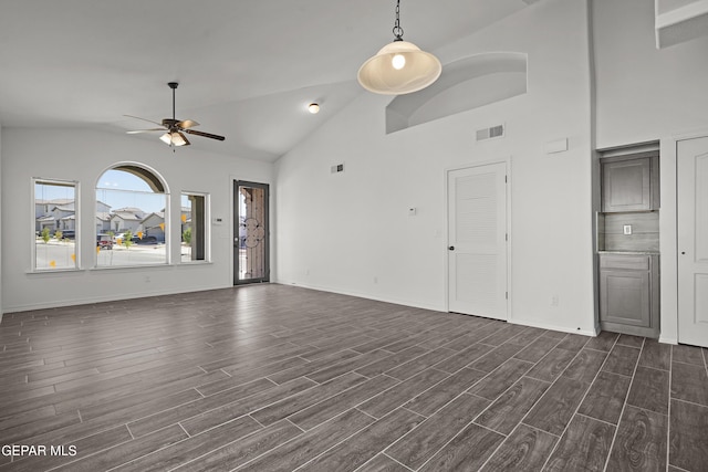 13158 Ludlow Ln, El Paso, TX 79928 - unfurnished living room featuring a ceiling fan, dark wood finished floors, and high vaulted ceiling
