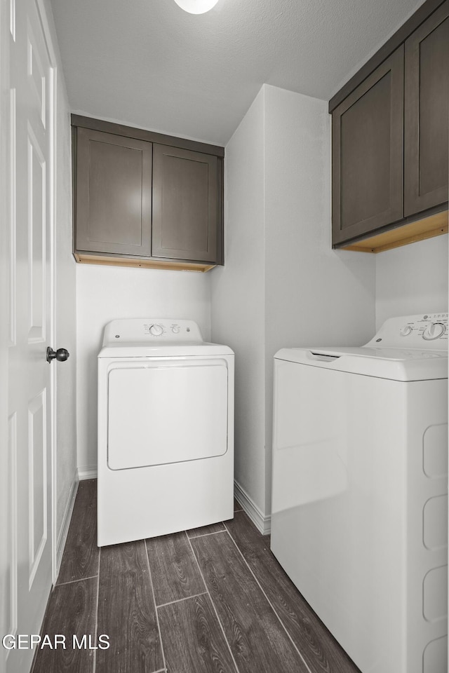 13158 Ludlow Ln, El Paso, TX 79928 - laundry area featuring cabinet space, washing machine and clothes dryer, and dark wood-style flooring