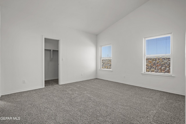 13158 Ludlow Ln, El Paso, TX 79928 - unfurnished bedroom with vaulted ceiling, carpet, and a spacious closet