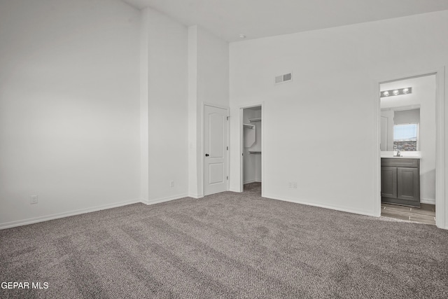 13158 Ludlow Ln, El Paso, TX 79928 - carpeted empty room with high vaulted ceiling and baseboards