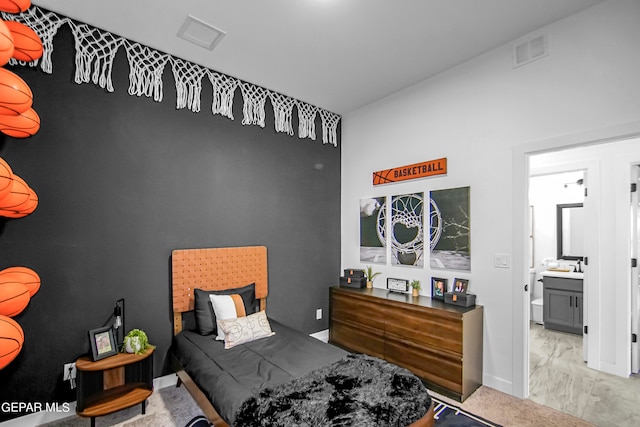 bedroom featuring ensuite bath