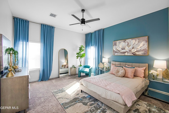 carpeted bedroom with ceiling fan