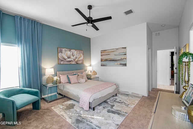 bedroom with ceiling fan and light colored carpet