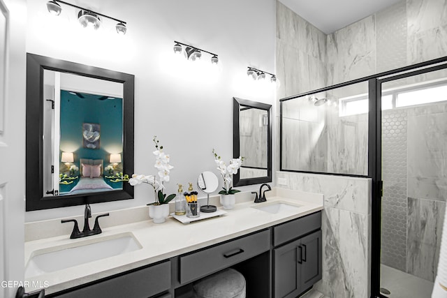 bathroom with tile walls, a shower with door, and vanity