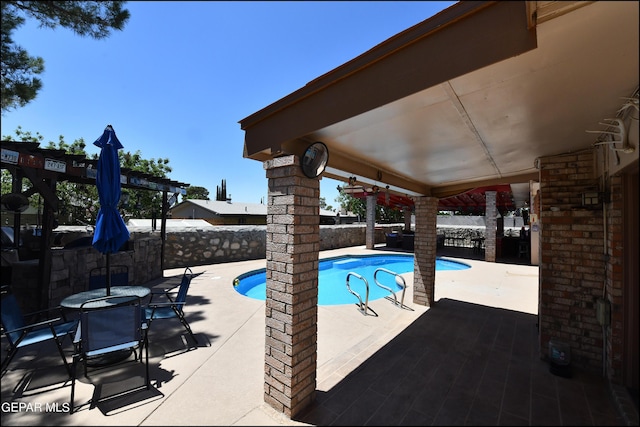 view of pool with a patio, fence, a fenced in pool, and a pergola