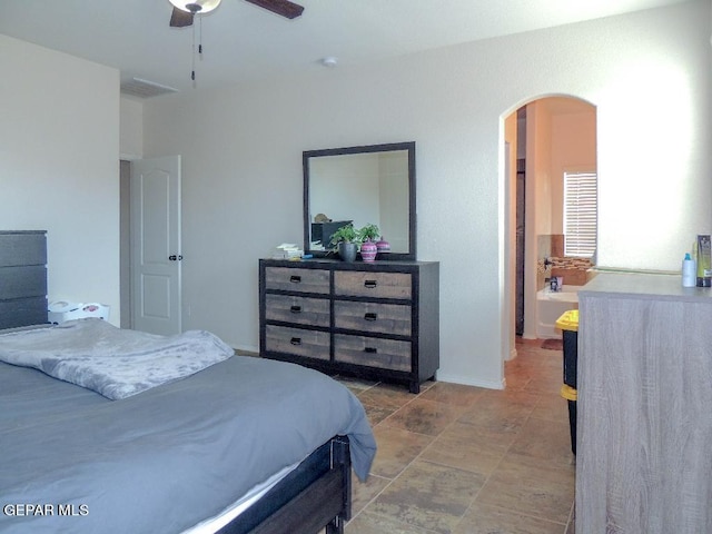 tiled bedroom featuring ceiling fan