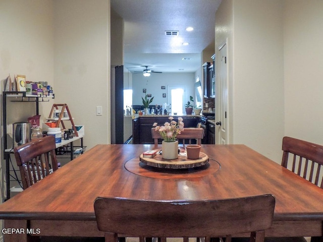 dining room featuring ceiling fan