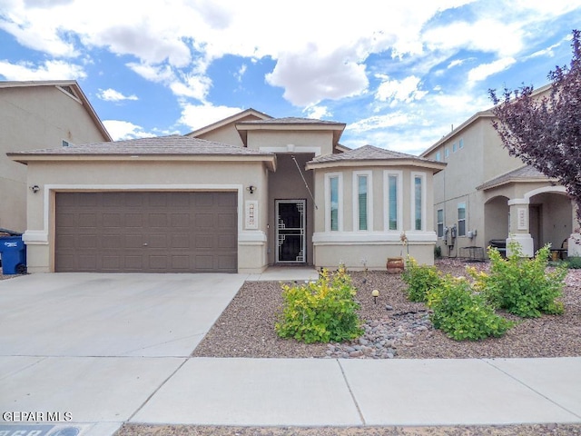 view of front of property with a garage