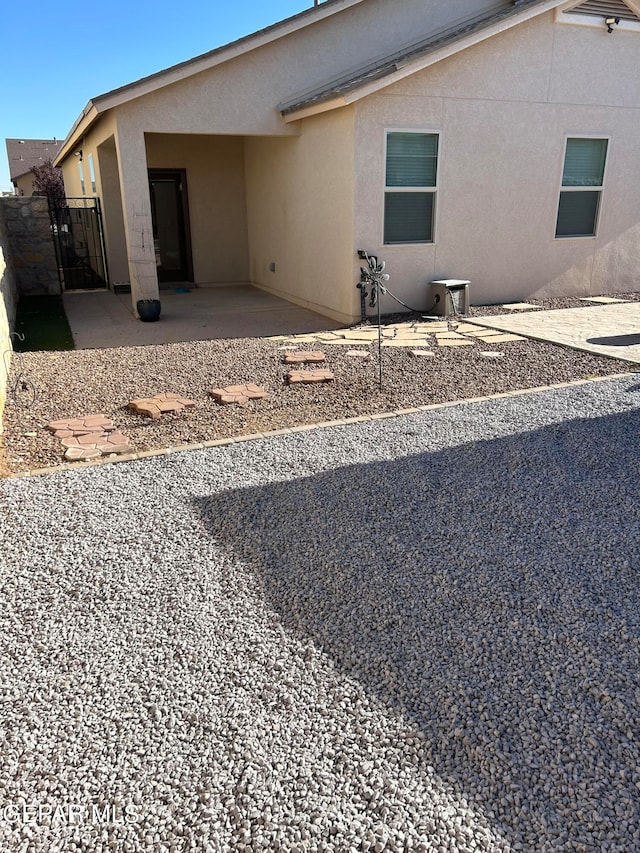 back of property featuring a patio