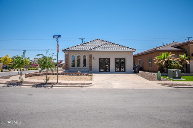 mediterranean / spanish-style home with central air condition unit