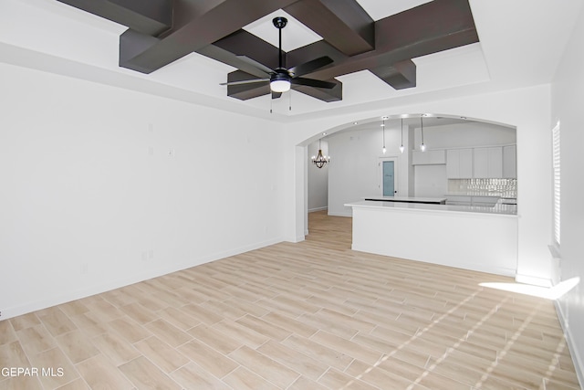 unfurnished living room featuring light hardwood / wood-style flooring and ceiling fan