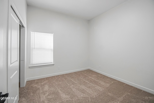 view of carpeted spare room