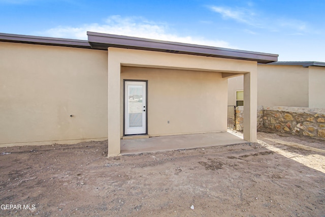 back of house with a patio