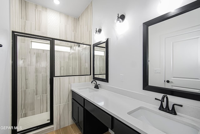 bathroom with vanity and an enclosed shower