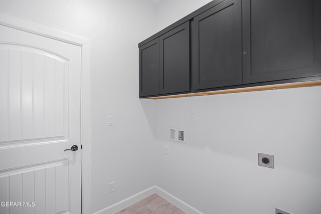 laundry area featuring washer hookup, cabinets, and hookup for an electric dryer