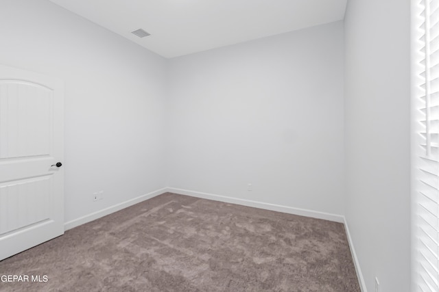 unfurnished room with carpet floors