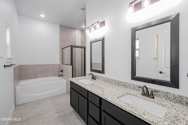 bathroom with vanity and plus walk in shower