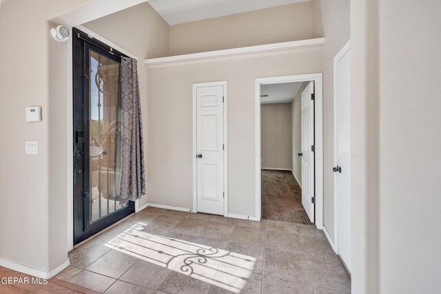 foyer entrance featuring light tile patterned floors