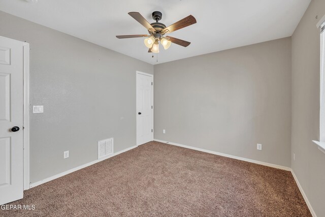 unfurnished room with carpet floors and ceiling fan