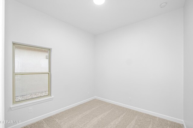 empty room featuring carpet floors