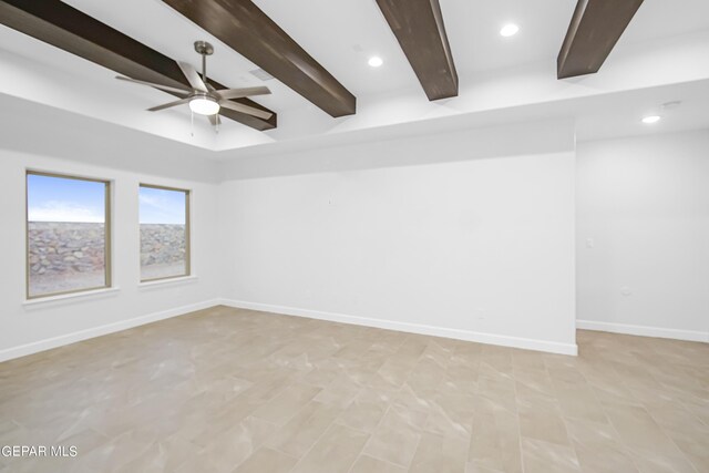 empty room featuring beam ceiling and ceiling fan