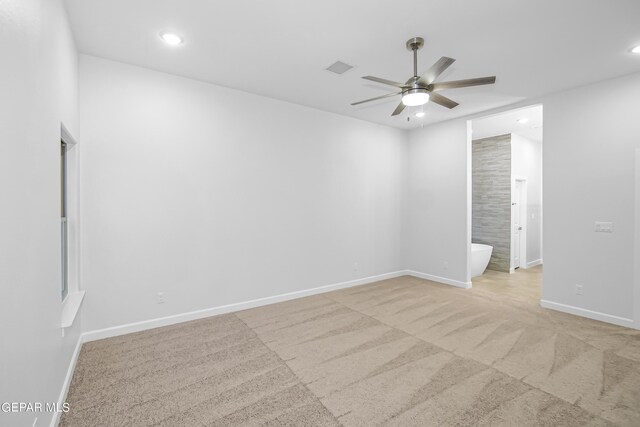 carpeted empty room with ceiling fan