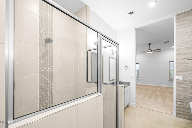 bathroom with vanity, tile patterned floors, ceiling fan, and an enclosed shower