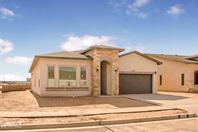 mediterranean / spanish house featuring a garage