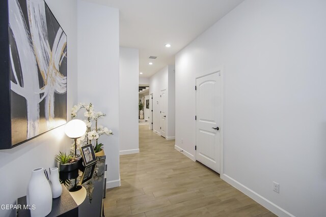 hall with light hardwood / wood-style flooring