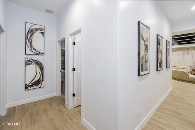 hallway with light wood-type flooring