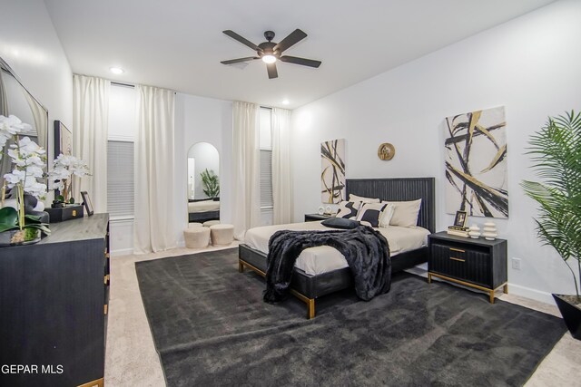 carpeted bedroom featuring ceiling fan