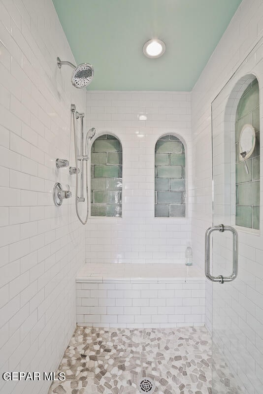 bathroom featuring an enclosed shower