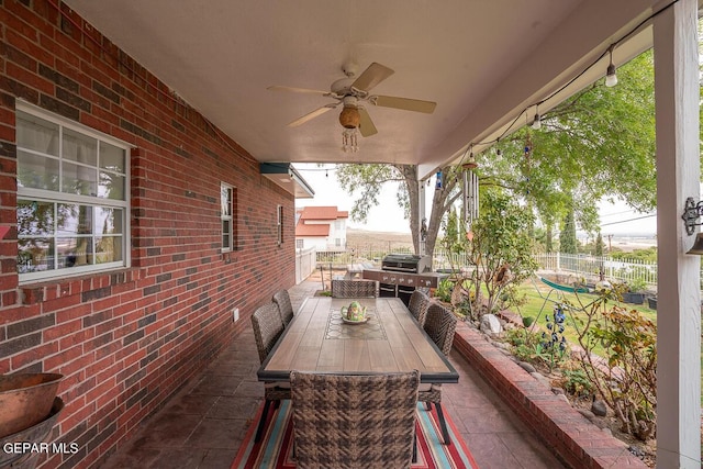 view of patio / terrace featuring outdoor dining space, ceiling fan, area for grilling, and fence