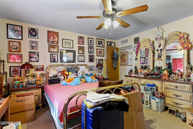 bedroom featuring ceiling fan, carpet floors, and visible vents