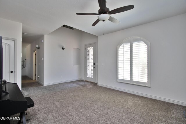 interior space with ceiling fan, carpet flooring, and baseboards