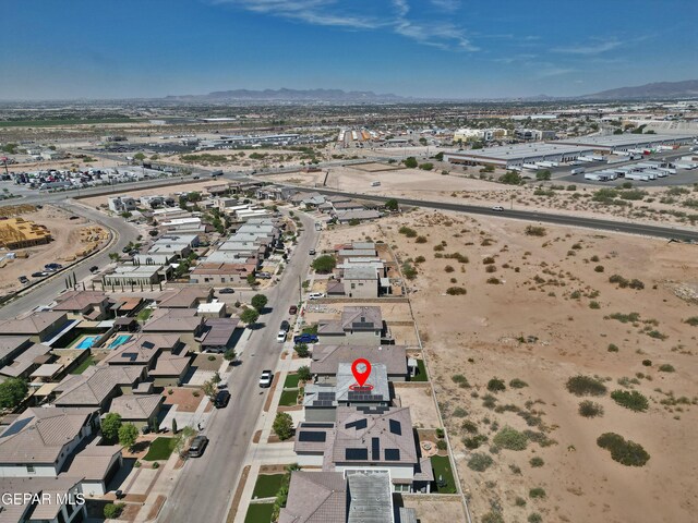 drone / aerial view with a residential view and a mountain view